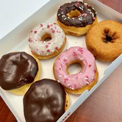 Dunkin' - Half dozen Dunkin' beauts. They look almost too good to eat. But they will most definitely be gobbled up in no time!