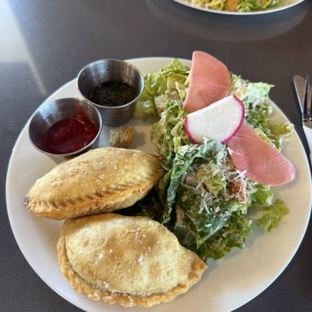 Empanada Stop - 1 Chicken & 1 Beef empanada plate with Caesar salad. Delicious! - Burgers Near Me - Gresham, Oregon