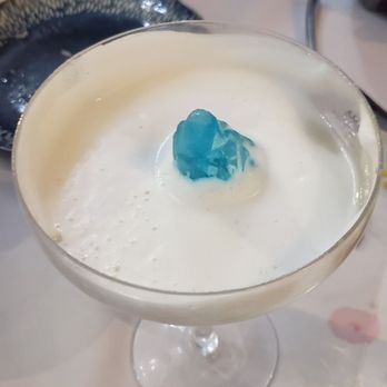 LimaMar Restaurant - Partially finished frothy "Altitude" cocktail: see the blue ice "mountain" in the "clouds?"  So cool!  And surprisingly delicious! - Peruvian Near Me - Rockford, Illinois