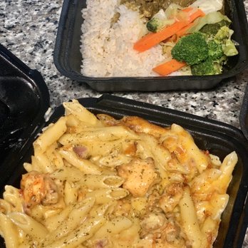 Jamaica House Grill - Lobster Mac & Cheese Curry Goat dinner  JUST LOOK AT IT! - Caribbean Near Me - Wellington, Florida