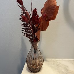 Dried floral arrangement and vase
