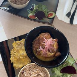 Chicken entree dish w/ plantain chips, fresh salad, rice, and some yummy Haitian chicken Chicken entree dish w/ plantain chips, fresh salad, rice, and some yummy Haitian chicken