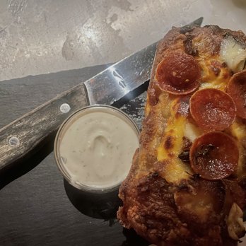 Quality Bistro - Garlic Pizza Truffle with ranch dressing on the side - French Near Me - New York, New York Quality Bistro - Garlic Pizza Truffle with ranch dressing on the side - French Near Me - New York, New York