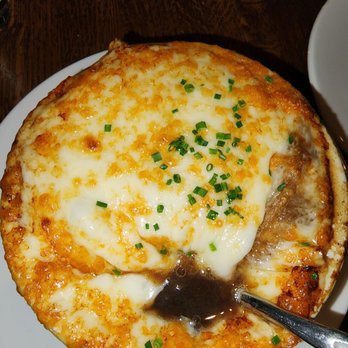 KC Prime - a cheese pizza on a plate with a spoon - Steakhouses Near Me - Warrington, Pennsylvania KC Prime - a cheese pizza on a plate with a spoon - Steakhouses Near Me - Warrington, Pennsylvania