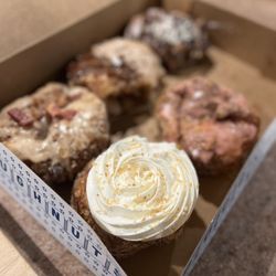 Parlor Doughnuts - Coconut cream, maple bacon, raspberry pistachio, cookies and cream and the French toast donut.