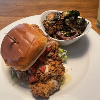 Howell's Kitchen and Bar - Pork chop sandwich and Brussels Sprouts - Pizza Near Me - Atlanta, Georgia