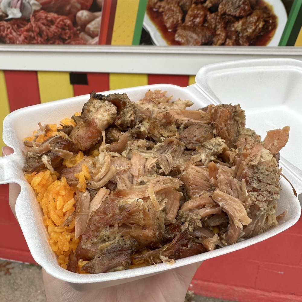 Cibao Market - a hand holding a container of food - Grocery Near Me - Windham, Connecticut