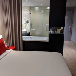 TRYP - The bed area looks directly into the bath area, but they can be separated by drawing the curtain.