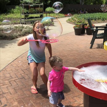 Dow Gardens - Blowing bubbles in the children's garden - Botanical Gardens Near Me - Midland, Michigan