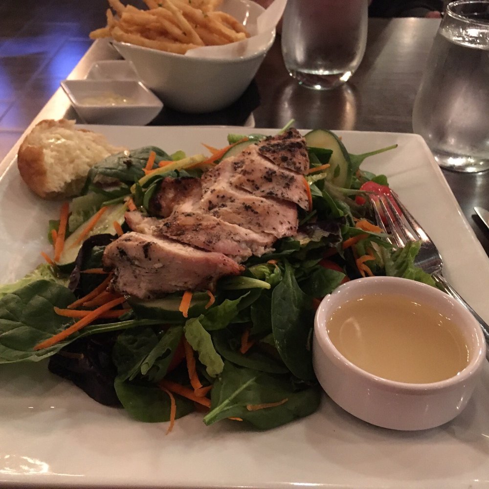 Barrel 21 Distillery And Dining - Salad with chicken, gin vinaigrette, truffle fries in back - Cocktail Bars Near Me - State College, Pennsylvania Barrel 21 Distillery And Dining - Salad with chicken, gin vinaigrette, truffle fries in back - Cocktail Bars Near Me - State College, Pennsylvania