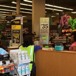 One of several clusters of lazy staff chatting away while disgruntled customers are bagging their own stuff One of several clusters of lazy staff chatting away while disgruntled customers are bagging their own stuff