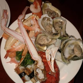 The Buffet - Oysters on the half shell, half cut crab legs and lobster tail. Shrimp and Chinese brocalli - Buffets Near Me - Valley Center, California