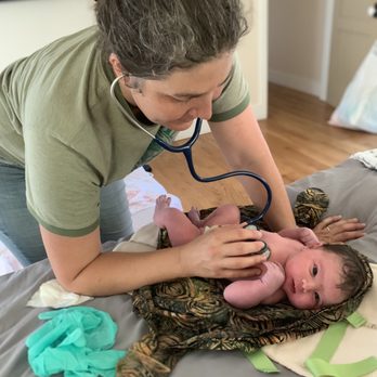 South Bay Birth - Tasha doing the newborn exam. Baby never leaves your side when you are at home. She is also so gentle and good with baby! 3 - Midwives Near Me - Redondo Beach, California