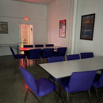 Black Potion - a large room with blue chairs and a white table - Bars Near Me - San Antonio, Texas Black Potion - a large room with blue chairs and a white table - Bars Near Me - San Antonio, Texas