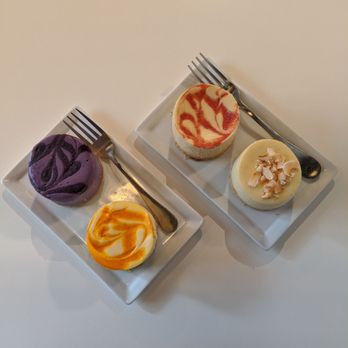 Hood Famous - Clockwise from purple: ube, guava, pandan coconut, and mango cheesecakes - Cafes Near Me - Seattle, Washington Hood Famous - Clockwise from purple: ube, guava, pandan coconut, and mango cheesecakes - Cafes Near Me - Seattle, Washington