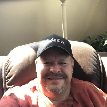 Town Pump Food Stores - a man sitting in a chair - Gas Stations Near Me - Columbus, Montana