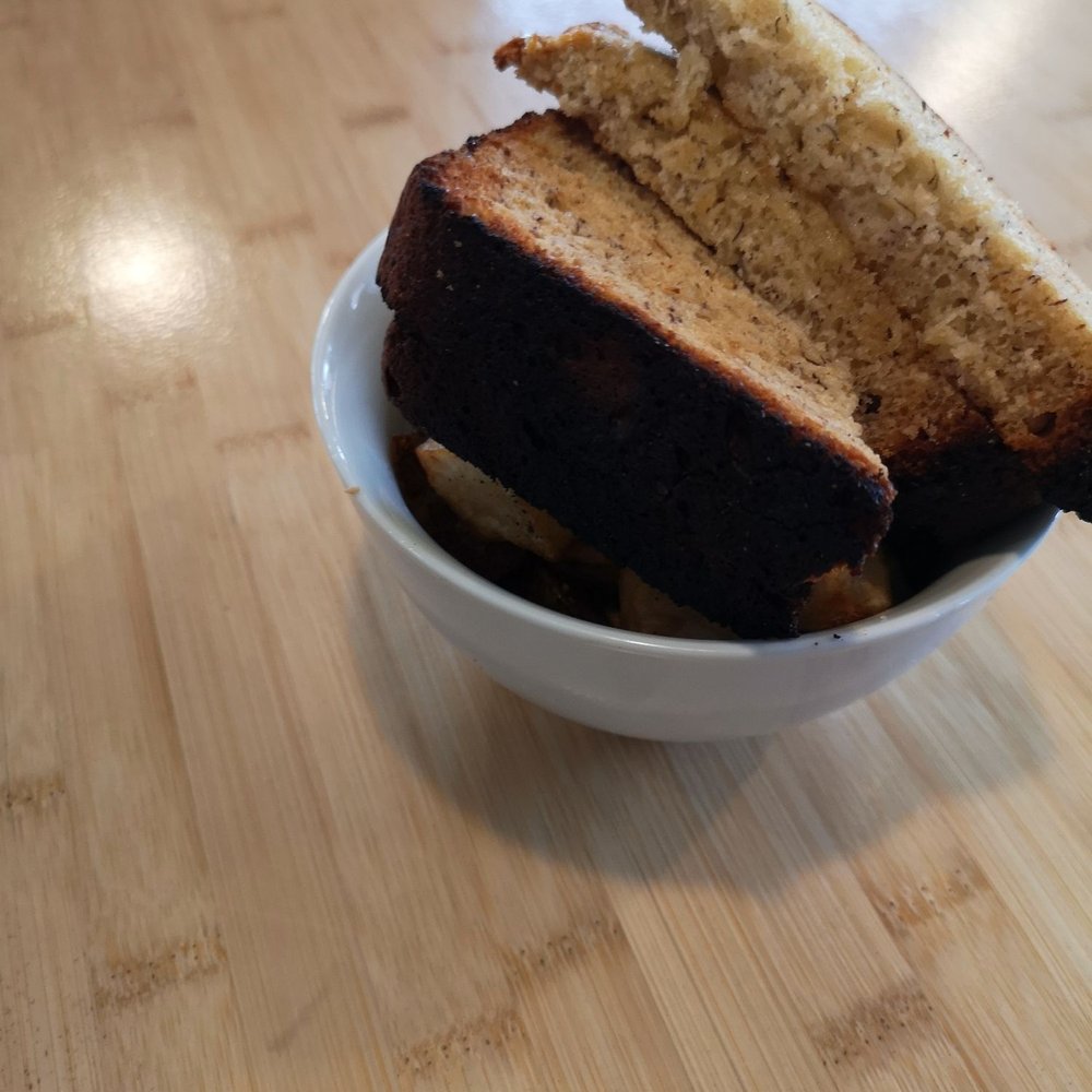 Banana bread on top of home fries.