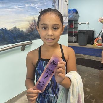 Gold Swim School - She has loved the ribbons she earned for each skill level - Swimming Lessons/Schools Near Me - Woodstock, Georgia Gold Swim School - She has loved the ribbons she earned for each skill level - Swimming Lessons/Schools Near Me - Woodstock, Georgia