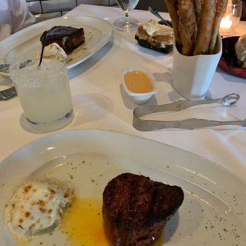 Steak 48 - Petite filet mignon (8 oz) with scalloped potatoes. Asparagus fries in the center of the table. - Steakhouses Near Me - Houston, Texas