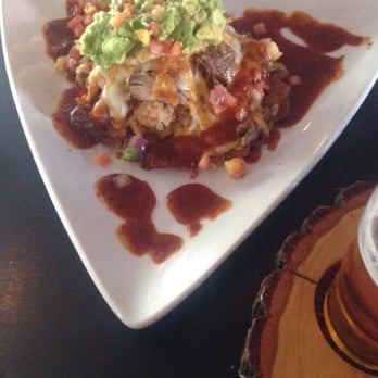The Perch Brewery - $14 Dressed tamale every bite is totally worth it. Topped with an egg and guacamole and pick and drenched in red chili sauce. - Gastropubs Near Me - Chandler, Arizona The Perch Brewery - $14 Dressed tamale every bite is totally worth it. Topped with an egg and guacamole and pick and drenched in red chili sauce. - Gastropubs Near Me - Chandler, Arizona
