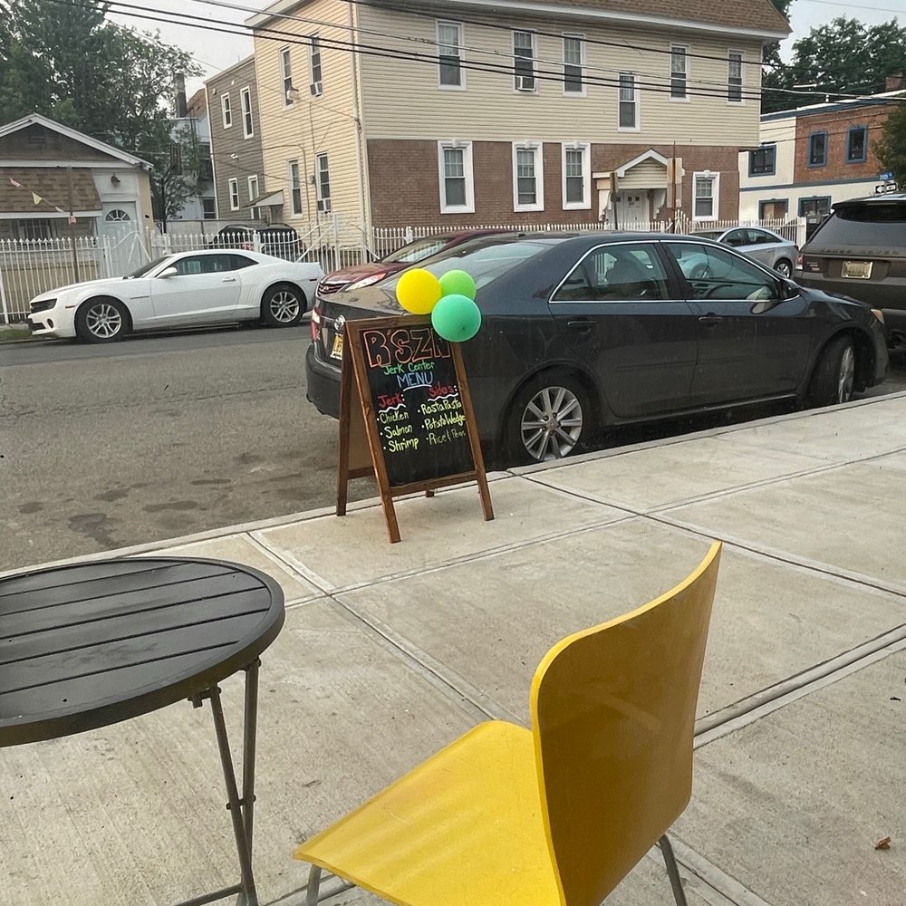 R'SZN Jerk Center - a yellow chair and a chalk board - Caribbean Near Me - Irvington, New Jersey R'SZN Jerk Center - a yellow chair and a chalk board - Caribbean Near Me - Irvington, New Jersey