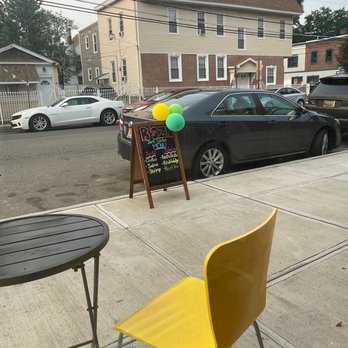 R'SZN Jerk Center - a yellow chair and a chalk board - Caribbean Near Me - Irvington, New Jersey R'SZN Jerk Center - a yellow chair and a chalk board - Caribbean Near Me - Irvington, New Jersey
