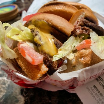 In-N-Out Burger - double double cut in half raw oninos - Burgers Near Me - Arcadia, California In-N-Out Burger - double double cut in half raw oninos - Burgers Near Me - Arcadia, California