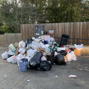 Canopy Glen - The main garbage area. During a hot day you can smell the garbage when you walk out of your front door. Yum!!!!!! - Apartments Near Me - Norcross, Georgia