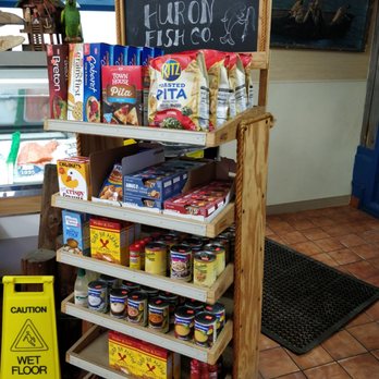 Huron Fish - a display of food items in a store - Seafood Markets Near Me - Saginaw, Michigan