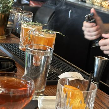 Dram & Draught - The rosemary was set ablaze and added as an aromatic (someone else's drink) - Cocktail Bars Near Me - Greensboro, North Carolina Dram & Draught - The rosemary was set ablaze and added as an aromatic (someone else's drink) - Cocktail Bars Near Me - Greensboro, North Carolina