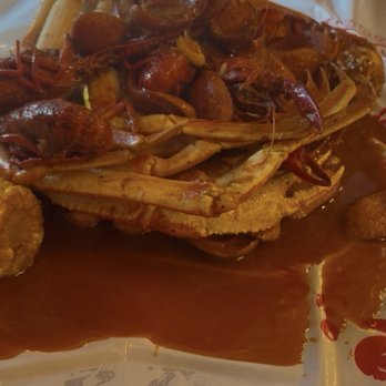 Pier 88 Boiling Seafood &Bar - Lobster tail, crab, sausage, crawfish in a Cajun garlic butter sauce with medium heat - Seafood Near Me - Temecula, California