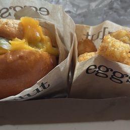 Sausage, egg & cheese sandwich and truffle tots Sausage, egg & cheese sandwich and truffle tots