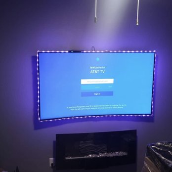 Atlanta TV Man - Curve tv mounted with led lights and fireplace - TV Mounting Near Me