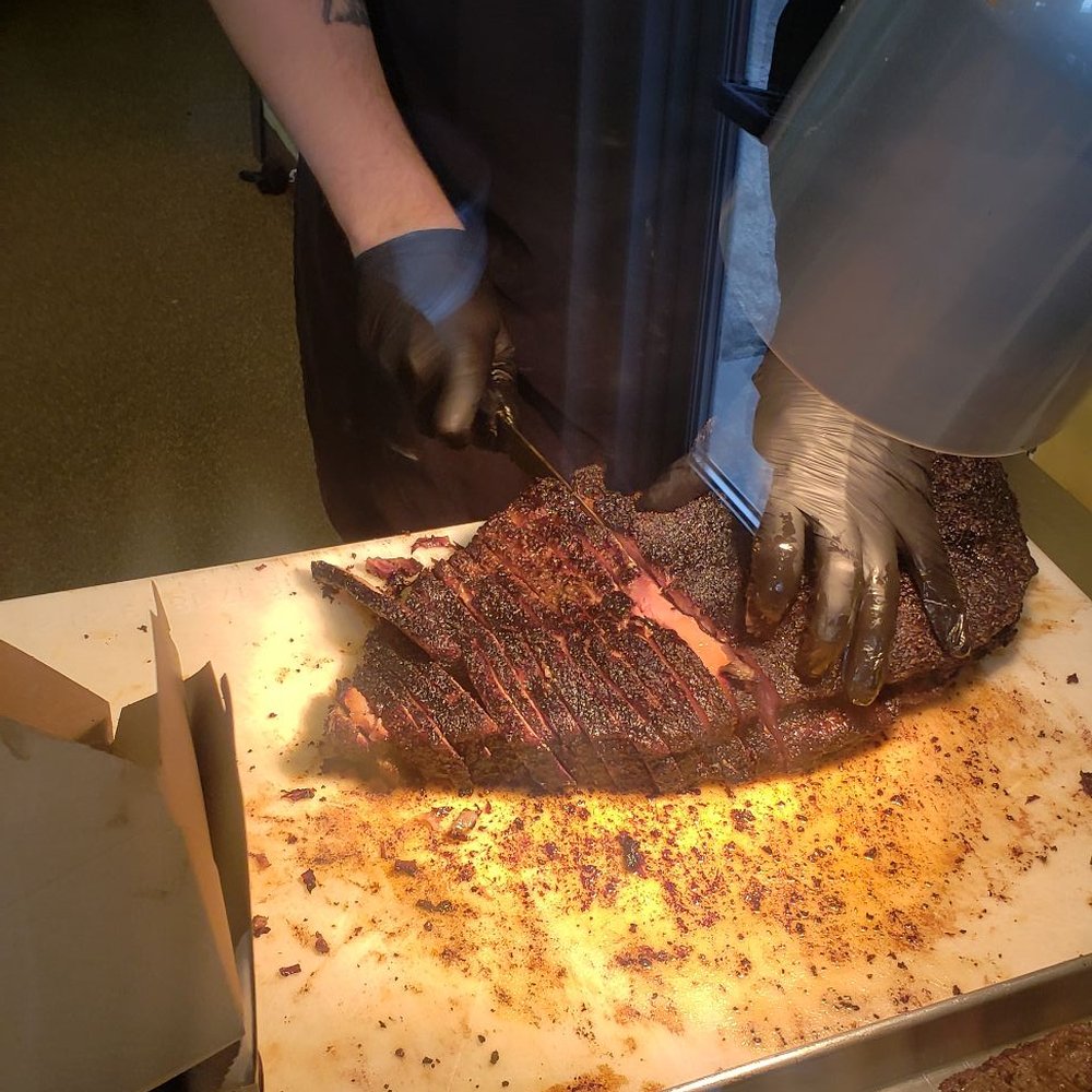Two Scotts Barbecue - Cutting the brisket. - Barbeque Near Me - Grand Rapids, Michigan Two Scotts Barbecue - Cutting the brisket. - Barbeque Near Me - Grand Rapids, Michigan