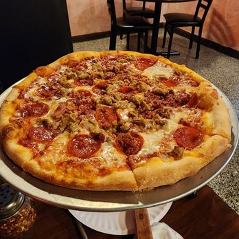 Mario's Pizza - a large pizza on a platter - Pizza Near Me - Owego, New York Mario's Pizza - a large pizza on a platter - Pizza Near Me - Owego, New York