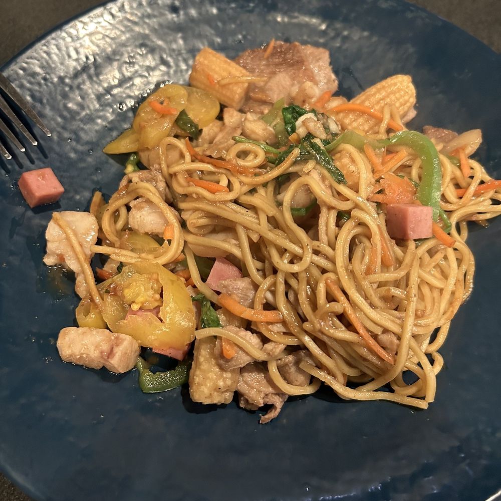 a plate of noodles with meat and vegetables a plate of noodles with meat and vegetables