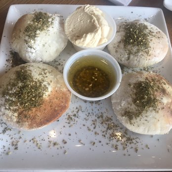 Mezza Mediterranean Grille - Pita bread with hummus and olive oil - Mediterranean Near Me - Detroit, Michigan Mezza Mediterranean Grille - Pita bread with hummus and olive oil - Mediterranean Near Me - Detroit, Michigan