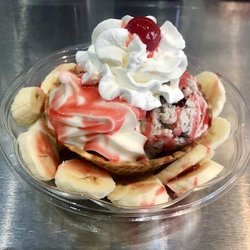New Yorker's Ice Cream & Treats - Banana Royal, ice cream in waffle bowl w/ diced banana, sauce topping, whipped cream, and cherry
