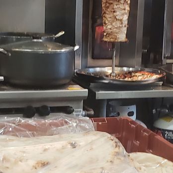 Anwar El Cajon market - Nice fresh flatbreads with the chicken shawarma spinning in the background. - Halal Near Me - El Cajon, California Anwar El Cajon market - Nice fresh flatbreads with the chicken shawarma spinning in the background. - Halal Near Me - El Cajon, California