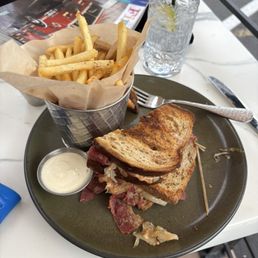 Reuben (partially eaten | phone forgot to eat first), fries, aoli