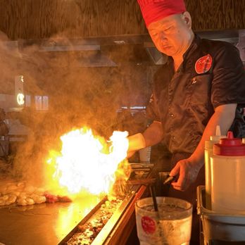 Saga Hibachi - 1 of 2 hibachi chefs cooking for our party. - Japanese Near Me - Mashpee, Massachusetts