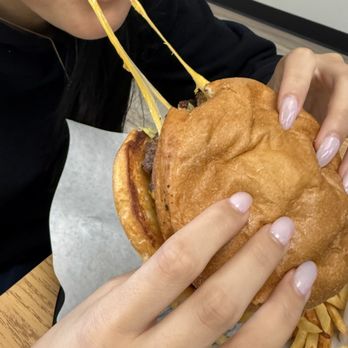 Santiago's New Mexican Grill - Cheeseburger with the perfect cheese pull. Yum! - New Mexican Cuisine Near Me - Albuquerque, New Mexico