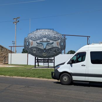 Worlds Largest Belt Buckle - World's Largest Belt Buckle, Abilene. With Sprinter van for scale. - Landmarks & Historical Buildings Near Me - Abilene, Kansas Worlds Largest Belt Buckle - World's Largest Belt Buckle, Abilene. With Sprinter van for scale. - Landmarks & Historical Buildings Near Me - Abilene, Kansas