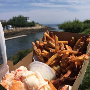 Footbridge Lobster - Lobster roll and fries. Crossed over the bridge to eat on the other side overlooking the town! - Seafood Near Me - Ogunquit, Maine Footbridge Lobster - Lobster roll and fries. Crossed over the bridge to eat on the other side overlooking the town! - Seafood Near Me - Ogunquit, Maine