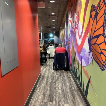 Highlands Cafè and Grill - a hallway with a mural of a butterfly - Coffee & Tea Near Me - Washington, DC, District of Columbia Highlands Cafè and Grill - a hallway with a mural of a butterfly - Coffee & Tea Near Me - Washington, DC, District of Columbia