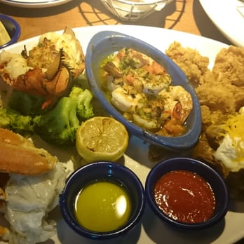 Red Lobster - Grand seafood feast!!! Crab legs, stuffed lobster, brown butter shrimp scampi and crispy fried shrimp. So good!! - Seafood Near Me - San Antonio, Texas Red Lobster - Grand seafood feast!!! Crab legs, stuffed lobster, brown butter shrimp scampi and crispy fried shrimp. So good!! - Seafood Near Me - San Antonio, Texas