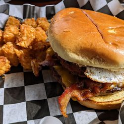 Grease Monkey Sports Bar & Grill - Burger, with egg, and hash browns.