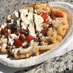 Carmel Coated Concessions - Customers funnel cake! Classic funnel cake with powder sugar, fresh strawberries, chocolate syrup and whipped cream