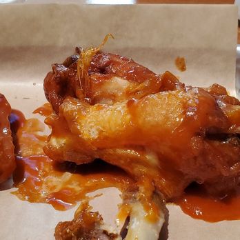 TJ's Catfish and Wings - This is a picture of some of the cooked feathers that was on this piece of chicken which is what made me loose my appetite. - Chicken Wings Near Me - Arlington, Texas