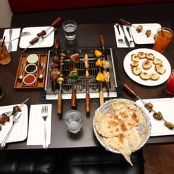 Town Grill - Live Charcoal Grill on your dining table with unlimited vegetarian and non-vegetarian skewers  and several other En-trees served.